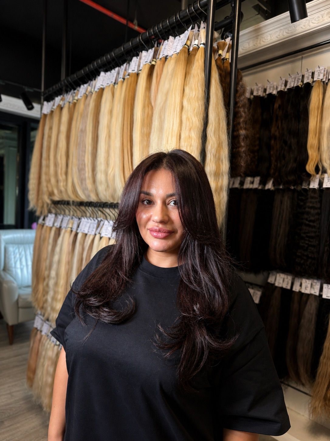 Hair extension specialist result with natural dark movement at ZORUMI™