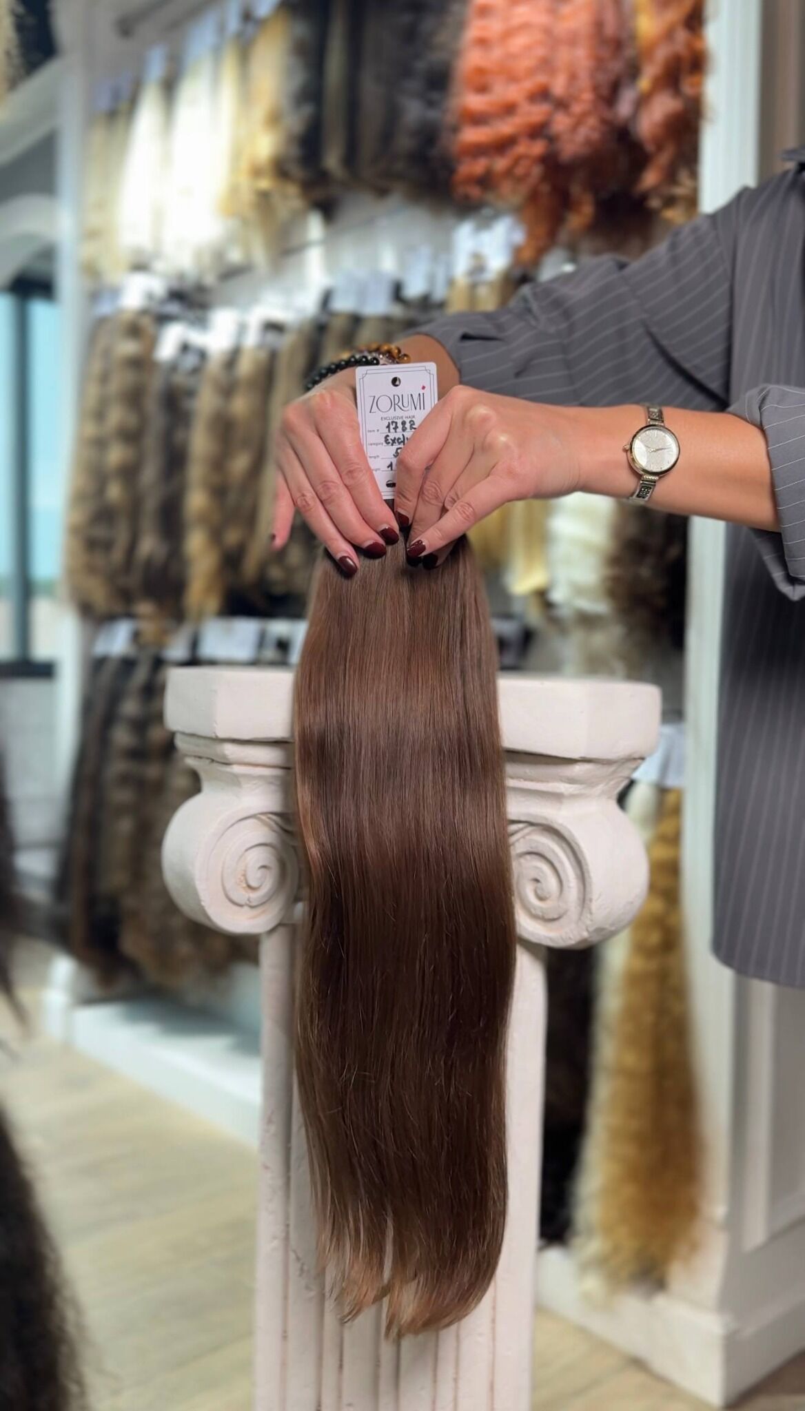 Long warm brown straight natural donor hair selected for extensions