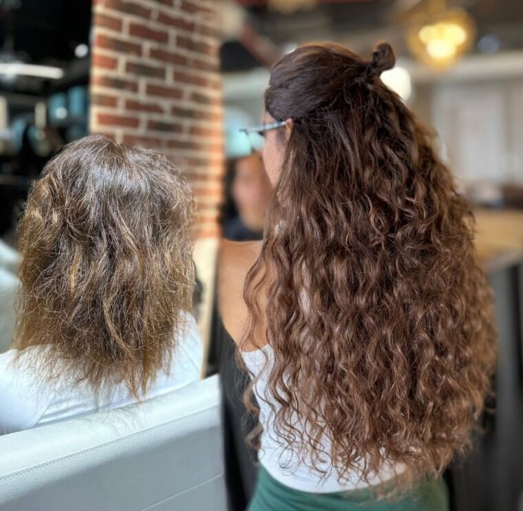 Long chestnut-brown hair before and longer fuller chestnut curls after a ZORUMI transformation