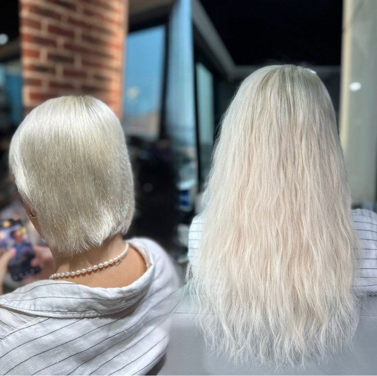 Short platinum bob before and longer softly waved platinum hair after a ZORUMI transformation