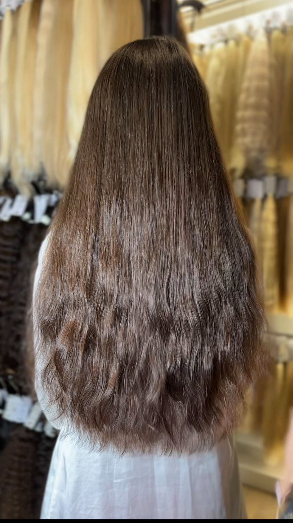 Long dark hair with natural movement at ZORUMI Dubai, back view